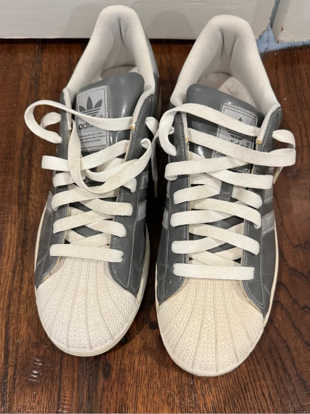 adidas Men’s Gray and White Shell Toe Sneakers